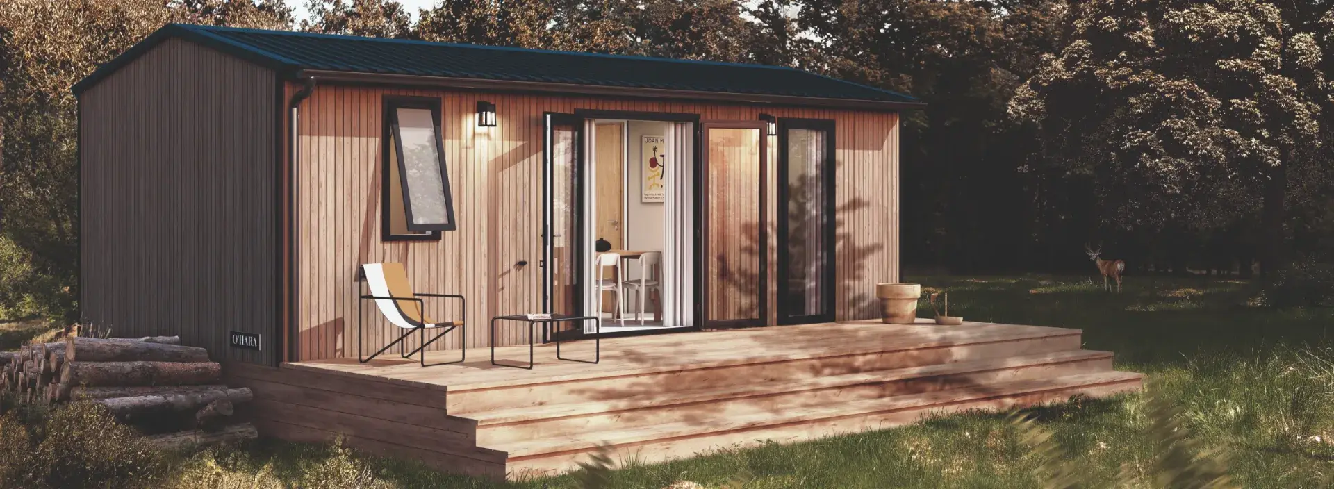 Mobil-home Suite avec bardage bois et grande terrasse en bois au milieu de la végétation